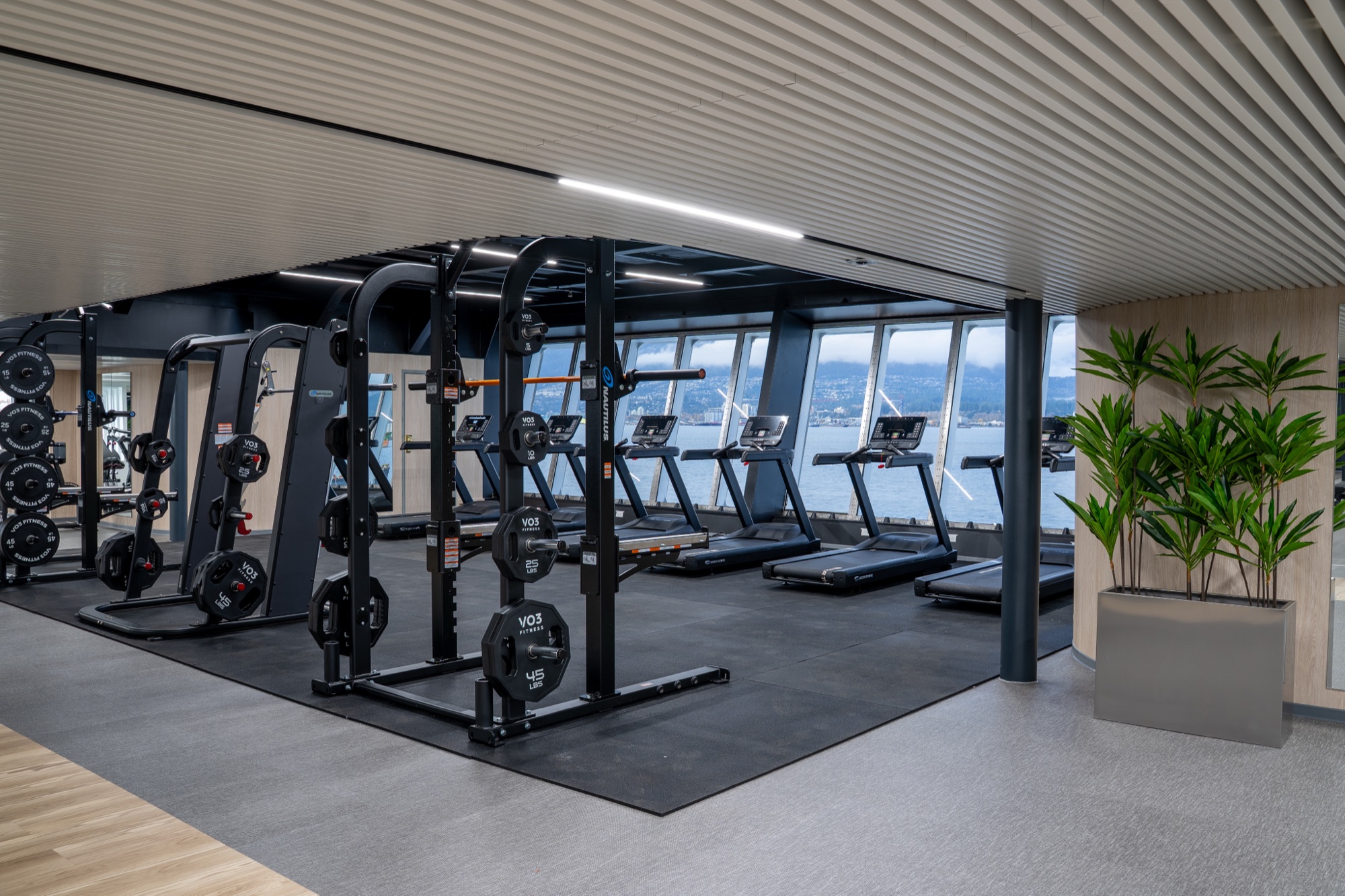 Waterfront cardio floor with premium equipment by Fit22